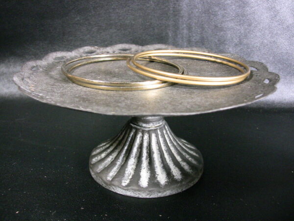 Four brass bracelets